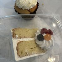 Vanilla cupcake and slightly lemon flavored vanilla cake.   at Cakes By Happy Eatery in Manassas