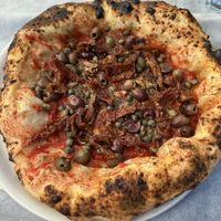 Vegan sun-dried tomato, olive, and caper marinara pizza   at Il Ruttino in Sorrento