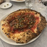 Vegan pizza with olives, sun dried tomatoes and capers. Vegan pasta with tomatoes,olives, courgette and peppers   at Il Ruttino in Sorrento