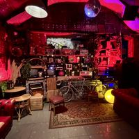 The bookshelf door leads to this cool function roomm  at Love Shack in East London