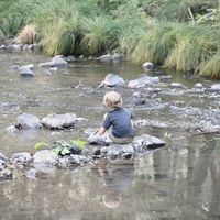 My kids by the river at Mandala Springs Retreat in Cobb