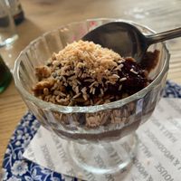 Dark chocolate mouse with berry compote and granola.  at The Old Granary in Wareham