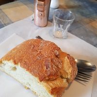 White wine and authentic bread at Diporto in Athens