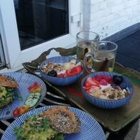 Delicious vegan breakfast, buns with no-chicken salad and yoghurt bowls with home made granola at Vegan B&B Valkenbos in The Hague
