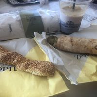 Freddo espresso, seitan gyro pitta, vegan cheese pastry, sesame pastry.  at Zorbas Bakery in Paphos