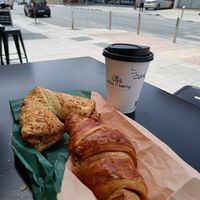 Raspberry croissant, almond pastry and oat cappuccino at Zorbas Bakery in Paphos