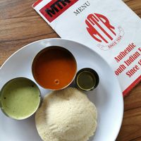 Single Rice Idly which is a steamed rice & black gram cake served with green chutney & lentil sambar.

I told them no ghee but they still served it separately so I just set it aside. at MTR Malaysia in Kuala Lumpur