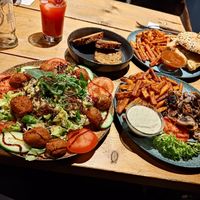 Vegan salad, tofu burger (of the month), side of sweet potato fries and mushrooms at Grill 69 in Dortmund
