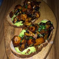 Toasted bread with avocado and marinated mushrooms at KAIME in Medellin