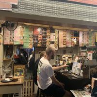 Inside - a table for two and 4 bar seats at Sushi Roll Double Quotation IKI in Osaka