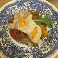 fried eggplant with cheesy sauce, capsicum and sultanas! at TxuKrut Bar in Bilbao