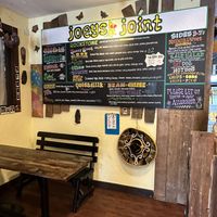 Menu board with seating   at Joey's Joint in Eastham