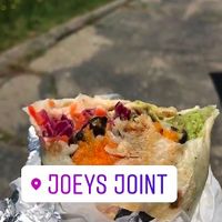 Pot head burrito! Baked sweet potato, carrot cabbage slaw, pico de gallo, guac, rice and beans, and a vegan chipotle aioli! at Joey's Joint in Eastham
