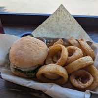 Black bean burger with onion rings at The Family Dog in Orono