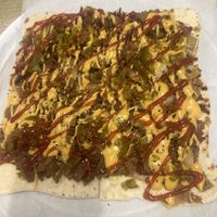 Cheesesteak flat bread. Beware: it has jalapeños on it   at Dina's Vegan Deli & Desserts in West Palm Beach