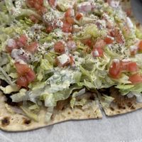 Gyro pizzaa  at Dina's Vegan Deli & Desserts in West Palm Beach