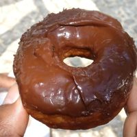 Donut with chocolate topping at DUH Vegan in Porto