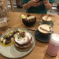 Tropical pancakes, açaí bowl, cappuccino and the Barbie latte  at EatMyTrip  in Barcelona