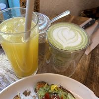 orange juice and matcha latte with oat milk  at EatMyTrip  in Barcelona