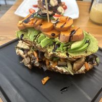 Vegan toast - hummus, avocado, roasted veg, and sweet potato    at Cheese and Cake in Barcelona