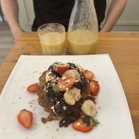 Vegan pancakes - fruit, jam and maple syrup and a smoothie  at Cheese and Cake in Barcelona