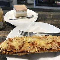 baked pizza sandwich and krémes at Napfenyes Cukraszat - Bajcsy Zsilinszky in Budapest
