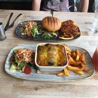 Bacon cheeseburger with jackfruit fries, lasagne with paprika chips  at Sage Vegan Cafe in Crawley