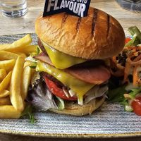 Bacon double cheeseburger with chips at Sage Vegan Cafe in Crawley