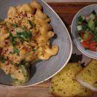 Pasta with garlic bread at Sage Vegan Cafe in Crawley