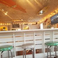 Tips in the ceiling! at Surfin' Spoon in Nags Head