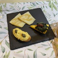 Variety of vegan starters : vegan cheese with rice Sirup, polenta with spinach and vegan tuna spread. So good!!  at La Pepiniere in Florence