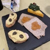 Finger foods: vegan tuna x2, polenta cake, vegan cheese   at La Pepiniere in Florence