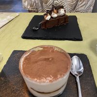 Tiramisu (good) and the chocolate/salted caramel cake (very good)   at La Pepiniere in Florence