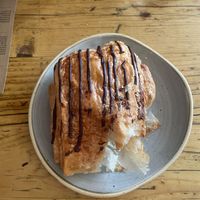 Pain au chocolat (with a bite taken out lol)  at Trading Post Coffee Roasters in Brighton
