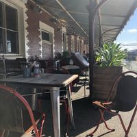 Outdoor seating on the train platform at BeanStation Cafe in Wodonga