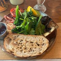 Sourdough toast with tomatoes, mushroom, arugula, fruit jam, and lemon  at Common Man Coffee Roasters in Central Singapore