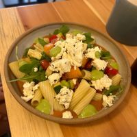 Pasta with cold tomato sauce, seasonal vegetables and feta (vegan cheese available).  at Kia Ora in Annecy