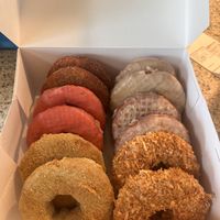 From back to front, left to right: cinnamon, cherry, key lime, maple, lemon, coconut donuts   at The Holy Donut - Commercial St in Portland