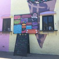 Order and pickup windows outside and menu at Bmore Licks in Baltimore