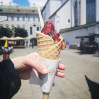 Dark chocolate ice cream, oreos and berry sauce. Vegan cone. Yum! at Kurt in Innsbruck
