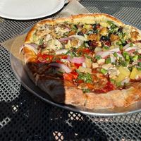 Pizza flight. 4 different pizzas in one. We chose pesto chickun, aloha BBQ, curse of the goat, and Mediterranean. Pesto was our favorite! HIGHLY RECOMMEND   at The Mitten Brewing Company in Saugatuck