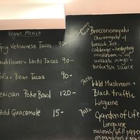 Menu on the wall  at Confusion Plant Based Kitchen in Hong Kong Island
