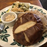 “Beef” (seitan) on pretzel bun with horseradish and pickle at 96 Lives Vegan Bakery and Cafe in Lancaster