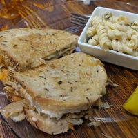 Seitan Reuben with a side of pasta salad and pickle! at 96 Lives Vegan Bakery and Cafe in Lancaster
