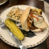 Philly cheesesteak with pasta salad  at 96 Lives Vegan Bakery and Cafe in Lancaster
