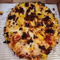 Build your own pizza with the 9" small thin style pan crust, banana peppers, pineapples, soyrizo, Daiya cheese, and marinara sauce at Pizza Cat in Toledo