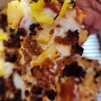 Build your own pizza with the 9" small thin style pan crust, banana peppers, pineapples, soyrizo, Daiya cheese, and marinara sauce at Pizza Cat in Toledo