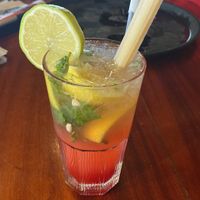 Red mojito drink with sugarcane  at Mundo's in Maputo