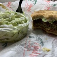 Veggie burger and cabbage salad 😋  at Woody's Oasis in East Lansing
