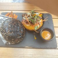 "The game changer" burger Beyond meat with sweet potatoes fries and spicy saus at Hustle n' Flow Eatery in San Pedro De Alcantara